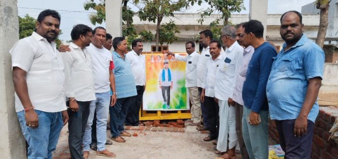 Chief Ministers portrait anointed with oil