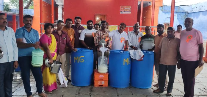Distribution of cow milk on the occasion of Naga Panchami
