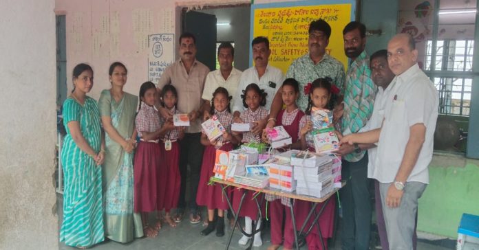 Distribution of notebooks to students..