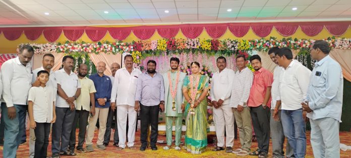 Ashok the priest blessed the newlyweds.