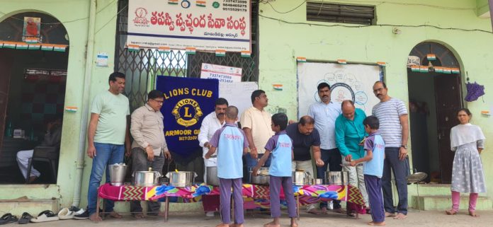 Donating food to an ascetic orphanage..