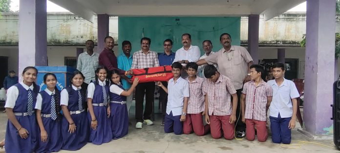 Providing sports equipment kits to school students