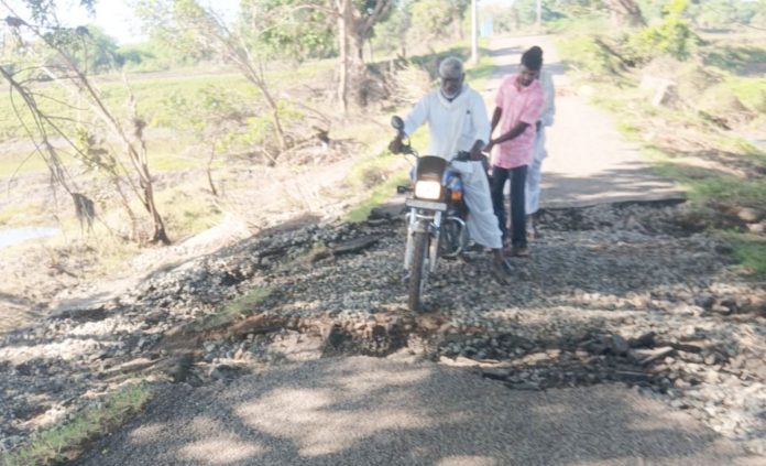 BT Road washed away by flood waters..