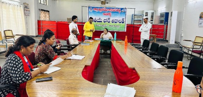 The judge who conducted the Lok Adalat meeting