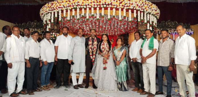 PACS Chairman Ippa Mondayya blesses the bride and groom PACS Chairman Ippa Mondayya blesses the bride and groom