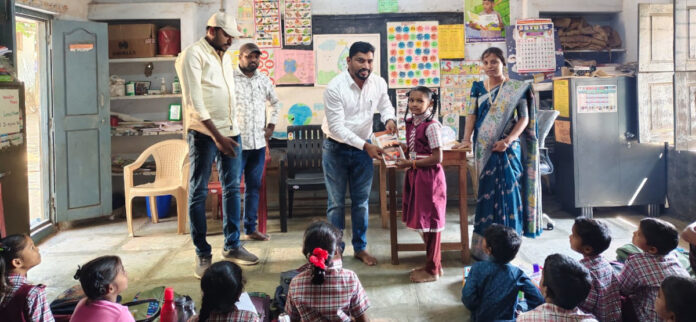 Providing notebooks, pencils, and slates to students