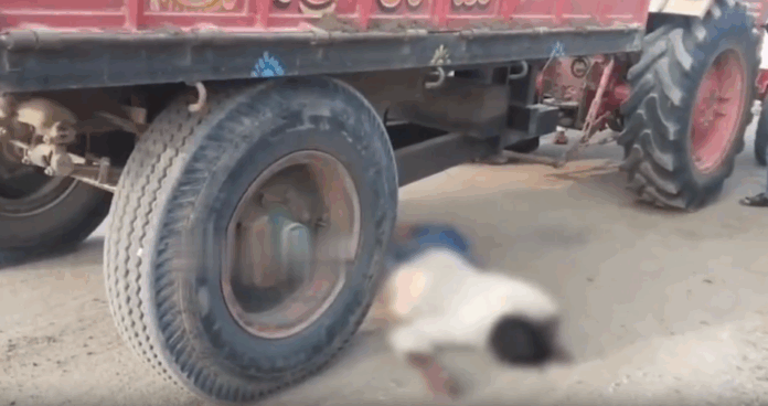 Man dies after falling under tractor tire