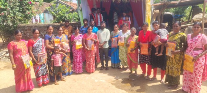 Distribution of sarees to women