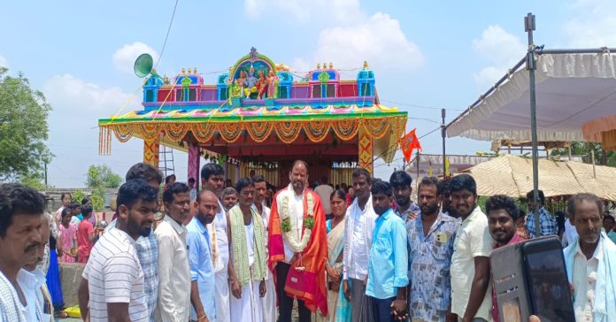 Busireddy Pandana at the flagpole re-establishment..