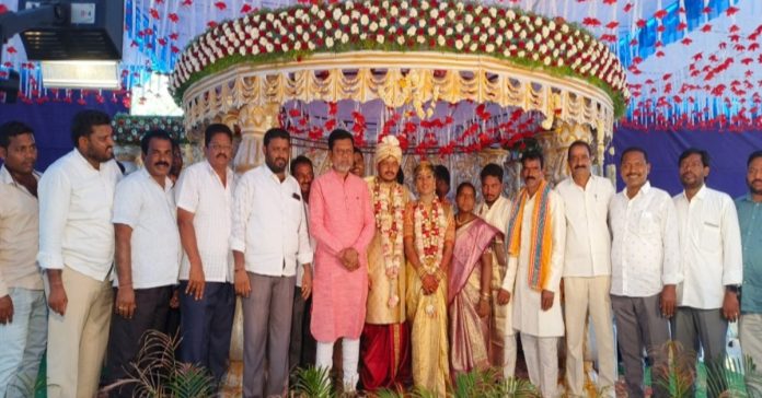 Former MLA blesses the bride and groom..