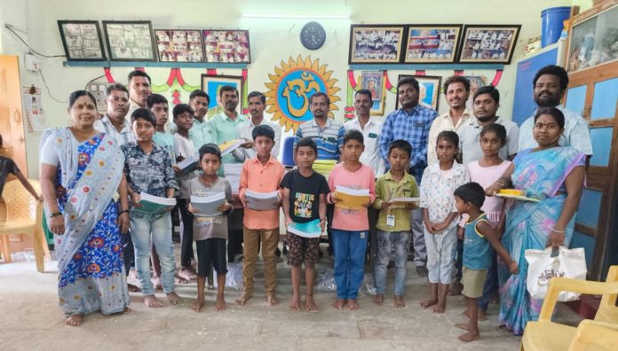Distribution of notebooks to students..