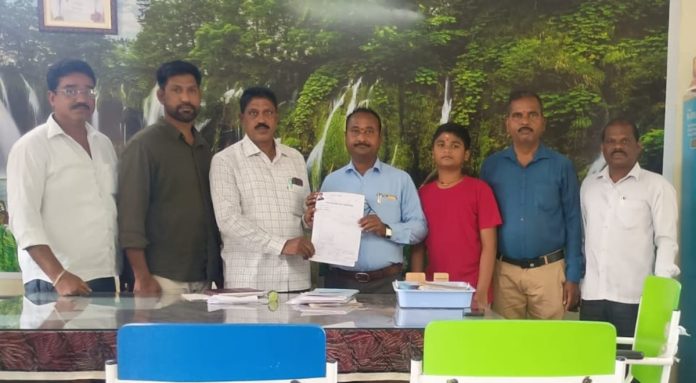 Government teacher who enrolled his son in a government school