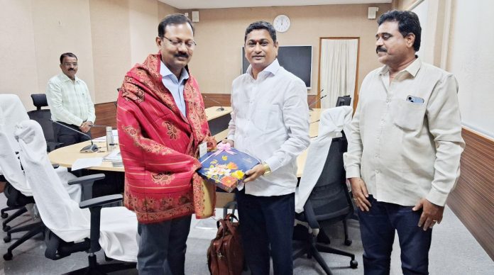 Keshavenu felicitates the new collector