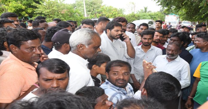 MP Vamsi Krishna inspects the car accident site.