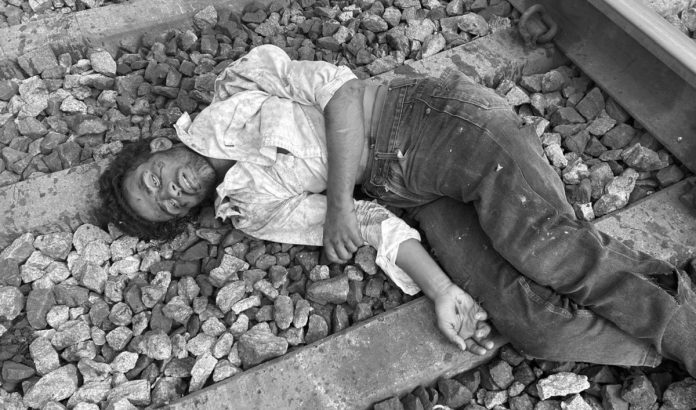 Youth commits suicide by falling under train