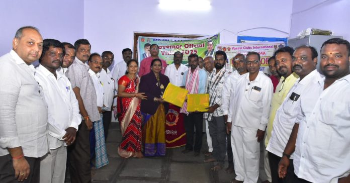 Distribution of note books on the occasion of Vasavi Club Silver Jubilee.