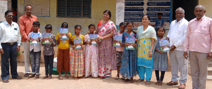 Distribution of note books to students