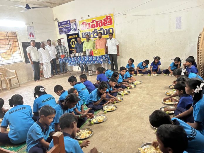 Food distribution organized by Lions Club of Balkonda Fort