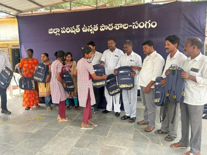 Distribution of school bags, notebooks and books to students