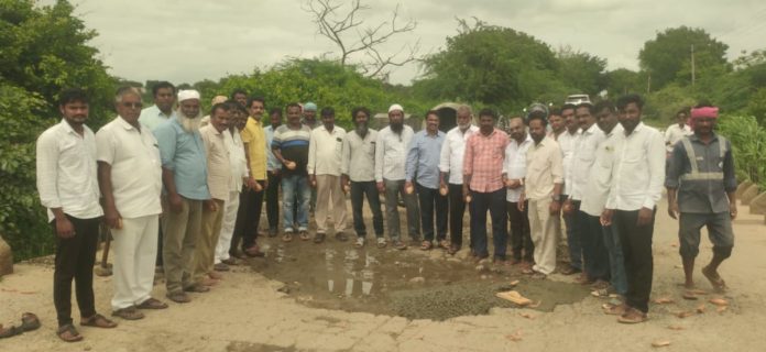 Villagers fill potholes on culverts