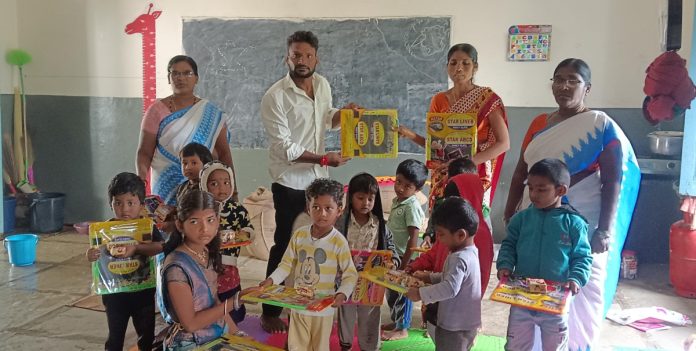 Asanna distributed notebooks and pens to students