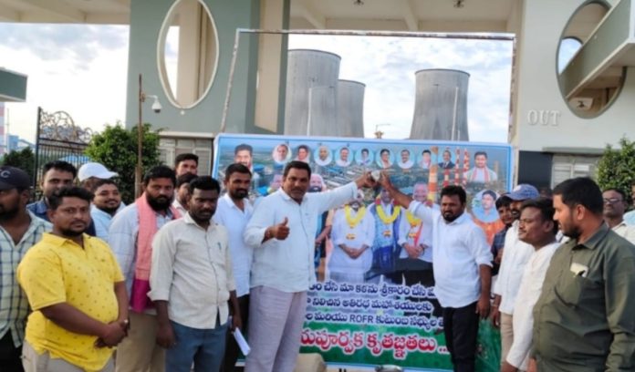 Displaced people celebrate in front of Yadadri Power Plant