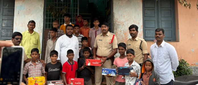 SI Vikram presents volleyball, net, and slippers to hostel students