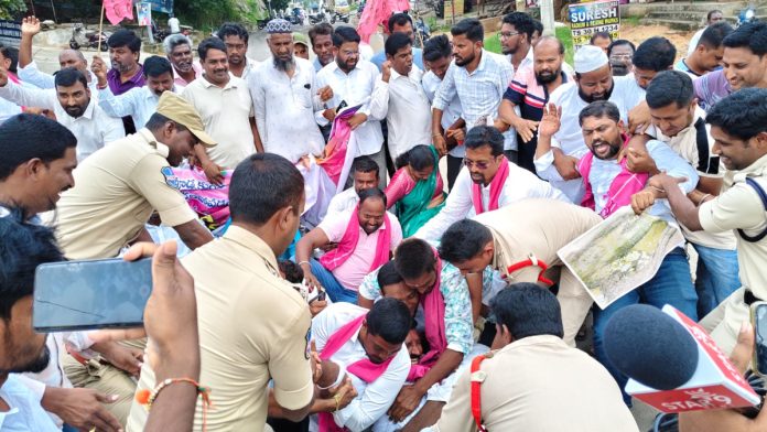 BRS dharna demanding repairs to Jagdepur Railway Bridge Road.