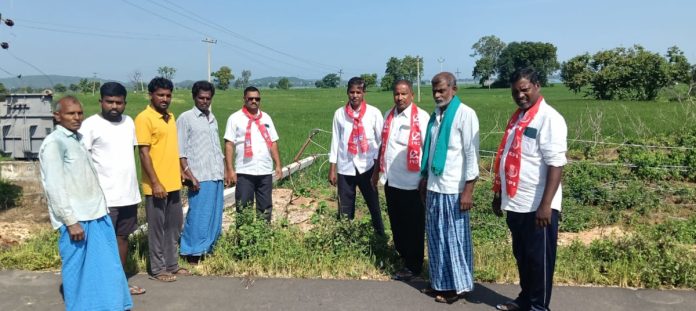 CPI leaders inspect fallen electricity poles in fields