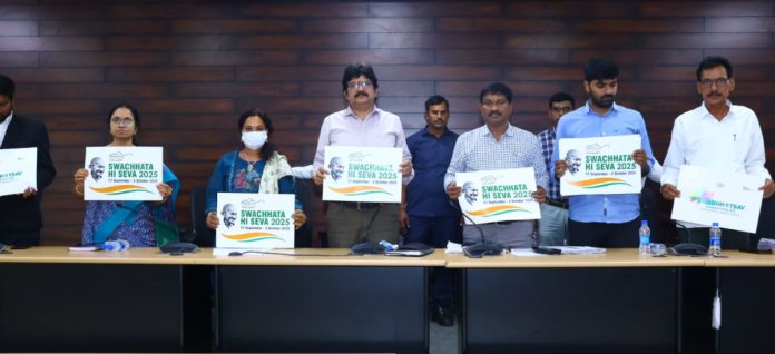 Collector unveils Swachhtahi - Seva 2025 postal stamp