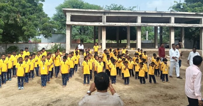 Distribution of sportswear to students with the help of Ramesh Teacher