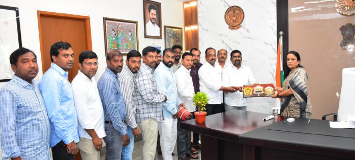 Government employees congratulate the Collector