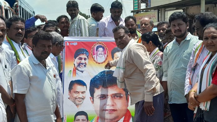 Minister Sridhar Babus portrait is anointed with oil