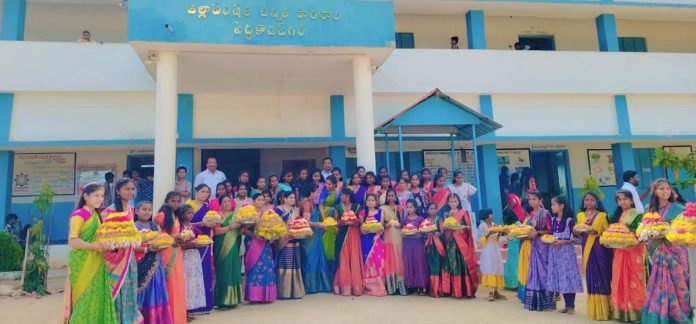 Students performed puja by arranging flowers on the beach