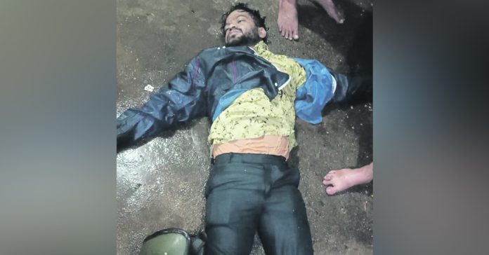 A young man died after being swept away by floodwaters.