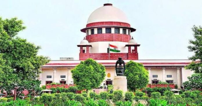 11-year-old boy climbs the steps of the Supreme Court...
