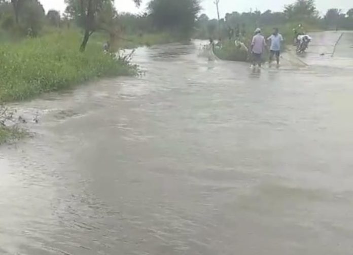 A stream overflowing due to heavy rain
