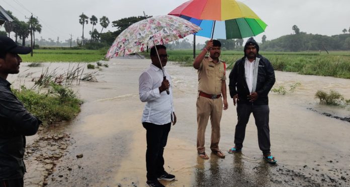 Rapidly flowing floodwaters block traffic Rapidly flowing floodwaters block traffic