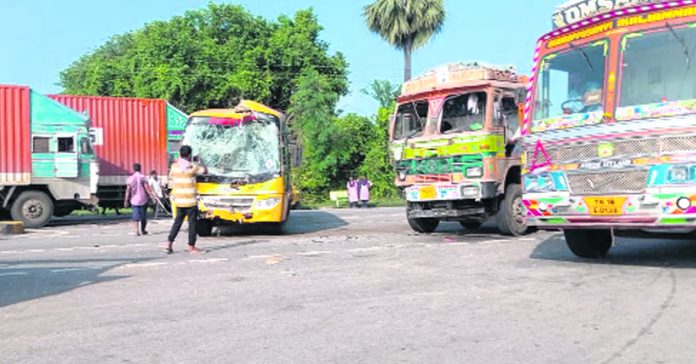 Two lorries hit a school bus