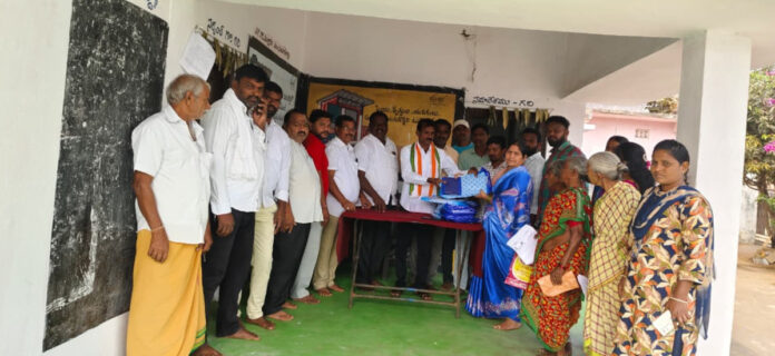 Distribution of Indiramma sarees in Mallaram