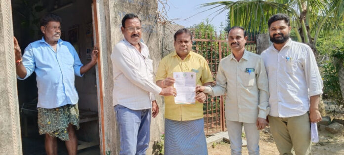 Distribution of documents of Gruha Jyoti Scheme to beneficiaries