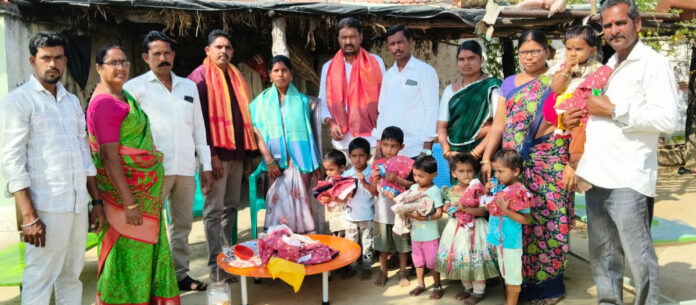 Sarpanch distributes uniforms to Anganwadi children