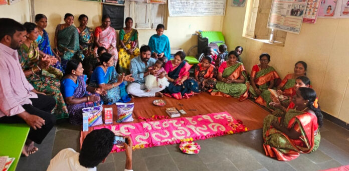 Feeding children at the Anganwadi center