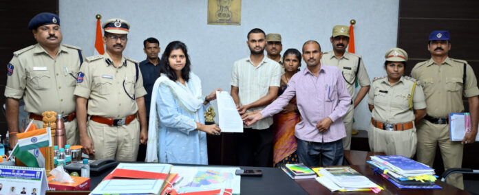 Collector presents appointment letter to Constable Soumya's brother