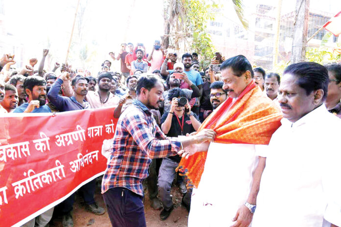 Guest workers salute the LDF rally.