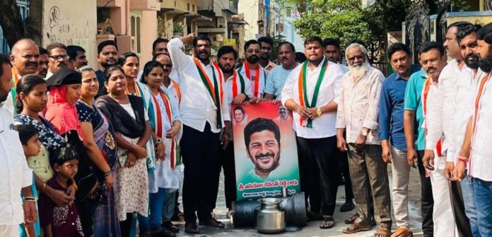 CM Revanth Reddy's portrait anointed with oil