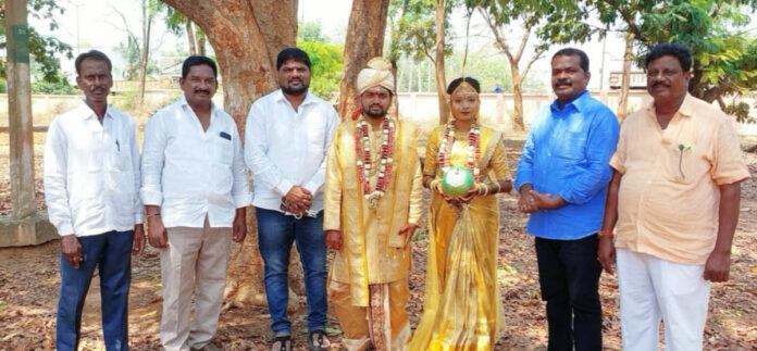 EGS State Member Dandu Ramesh blesses the bride and groom