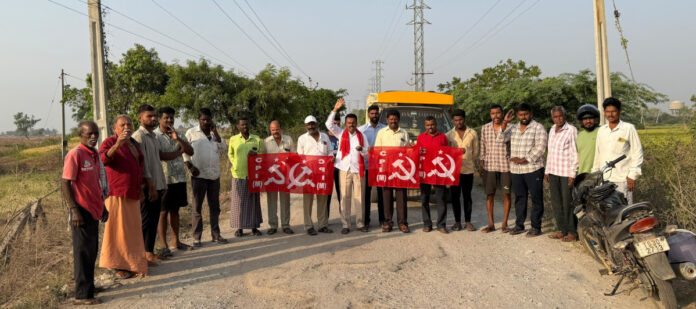 The potholed road should be converted into a BT road.