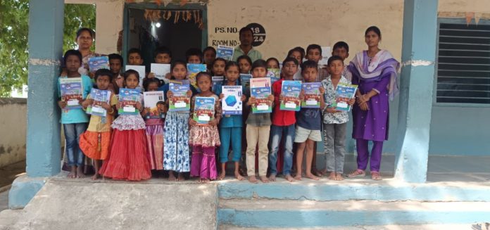 Distribution of notebooks and textbooks to students.