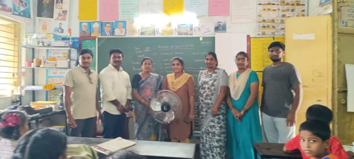 Councilor Katta Sindhuja donates a fan to the school.